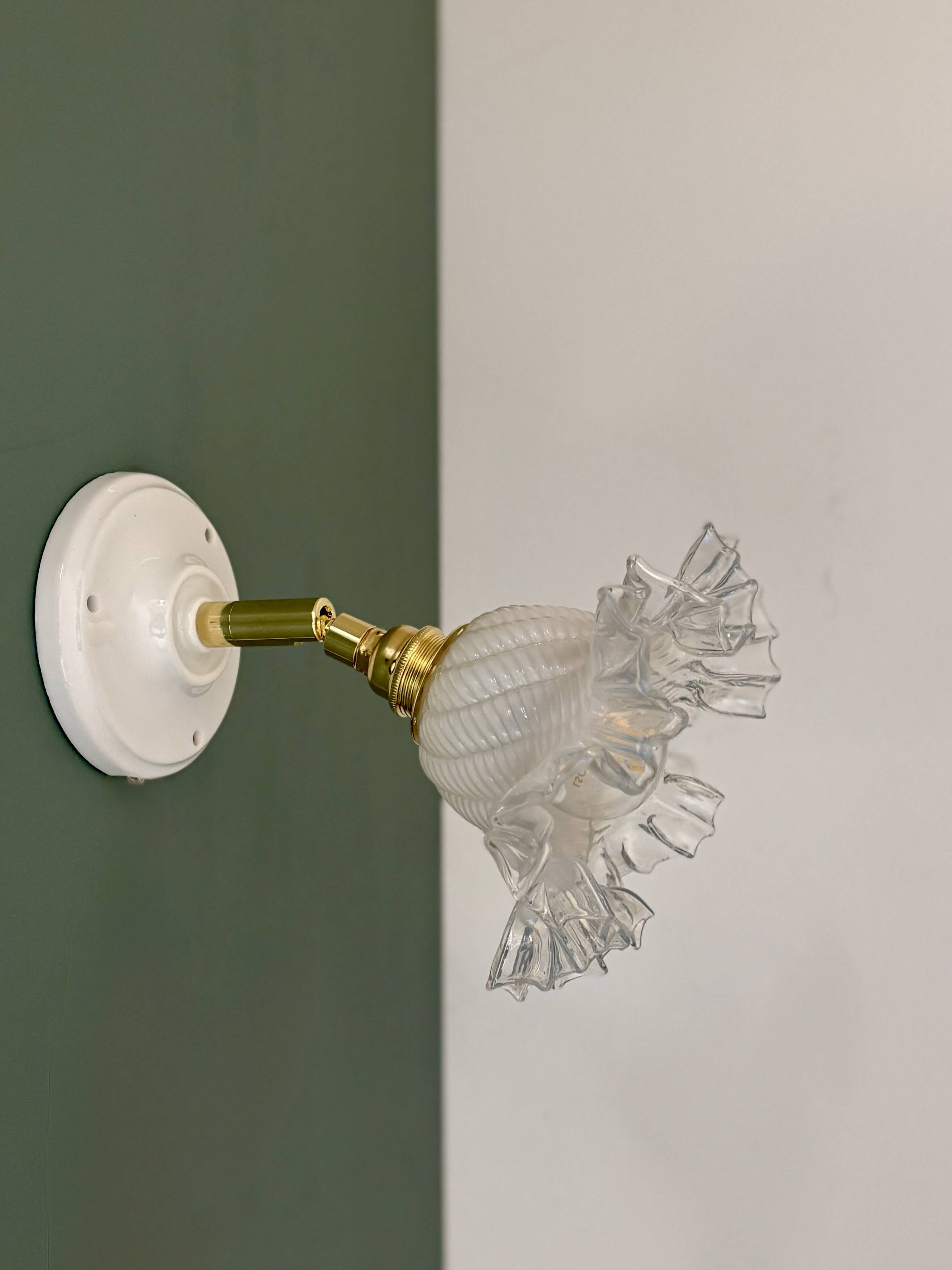 Vintage tulip glass wall light in transparent, slightly pearlescent white.