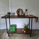Large central kitchen island trolley on wheels serving industrial console