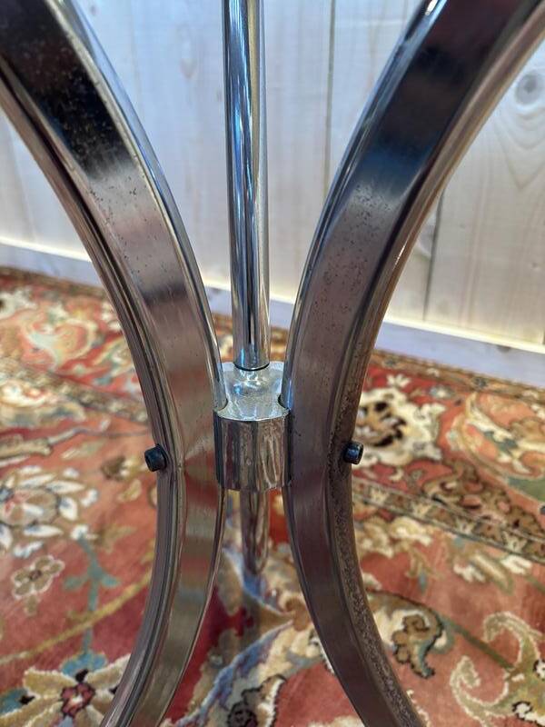 Contemporary glass and chrome dining table.