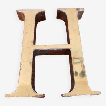 Golden sign letter “H”