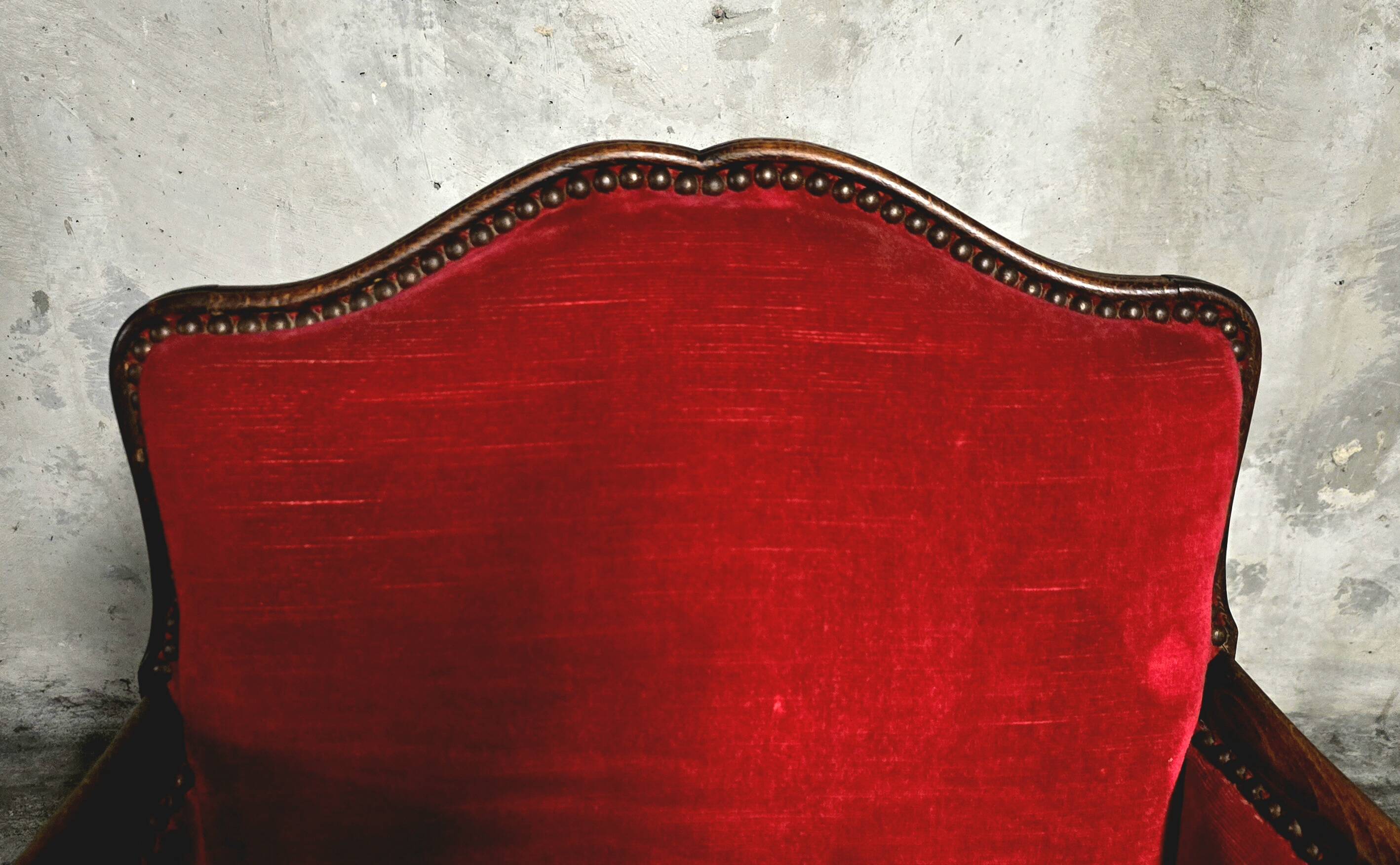 Pair of Louis XV style bergère armchairs in red velvet.