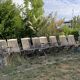 Folding garden chairs and armchairs in River Han dowelled teak.