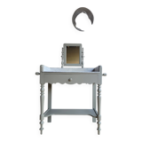 Antique wooden dressing table with marble top and mirror.