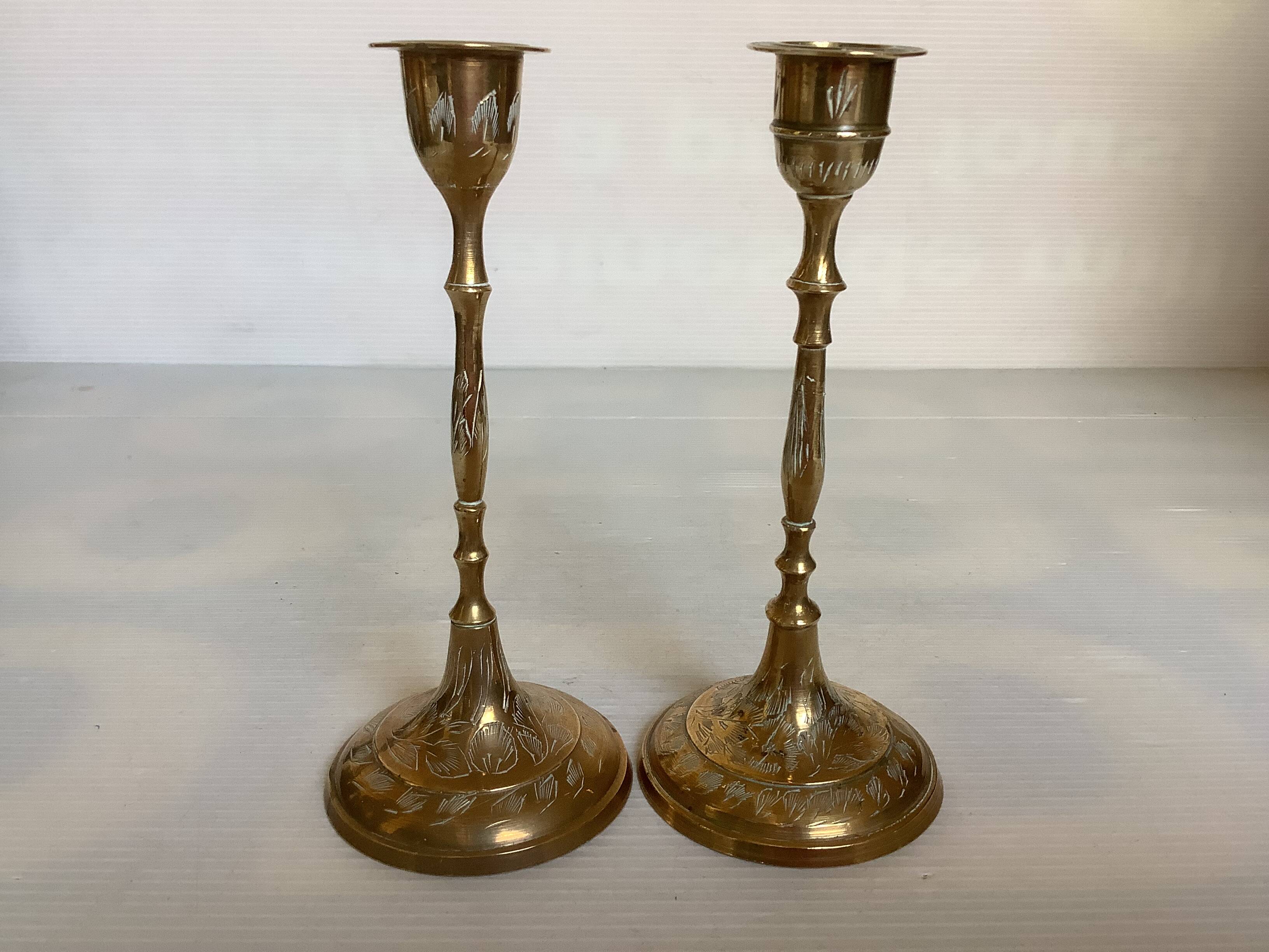 Pair of worked brass candlesticks