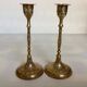 Pair of worked brass candlesticks