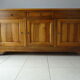 Very much in solid walnut, 3 doors.