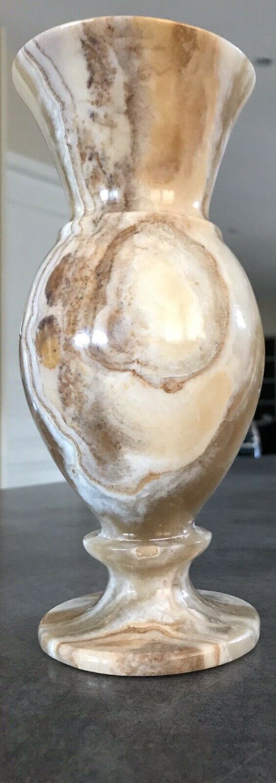 Vintage vase in marbled onyx stone shades of beige and brown