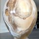 Vintage vase in marbled onyx stone shades of beige and brown