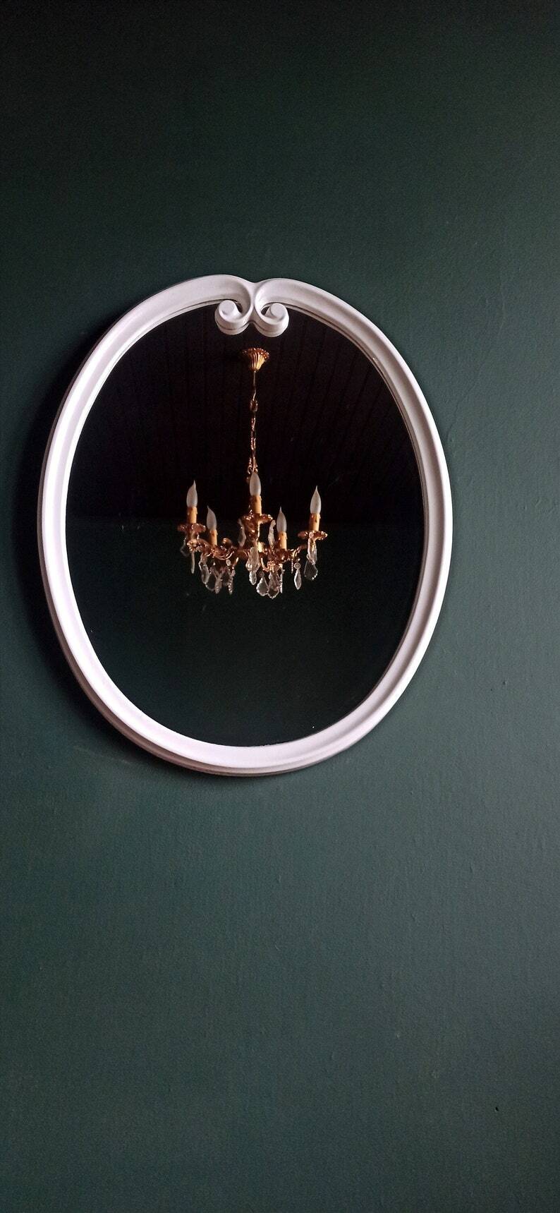 Large oval mirror in vintage white enamelled cast iron