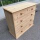 Victorian commode from the 19th century stripped to raw solid wood with ceramic knobs.