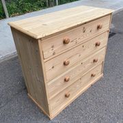 Victorian commode from the 19th century stripped to raw solid wood with ceramic knobs.