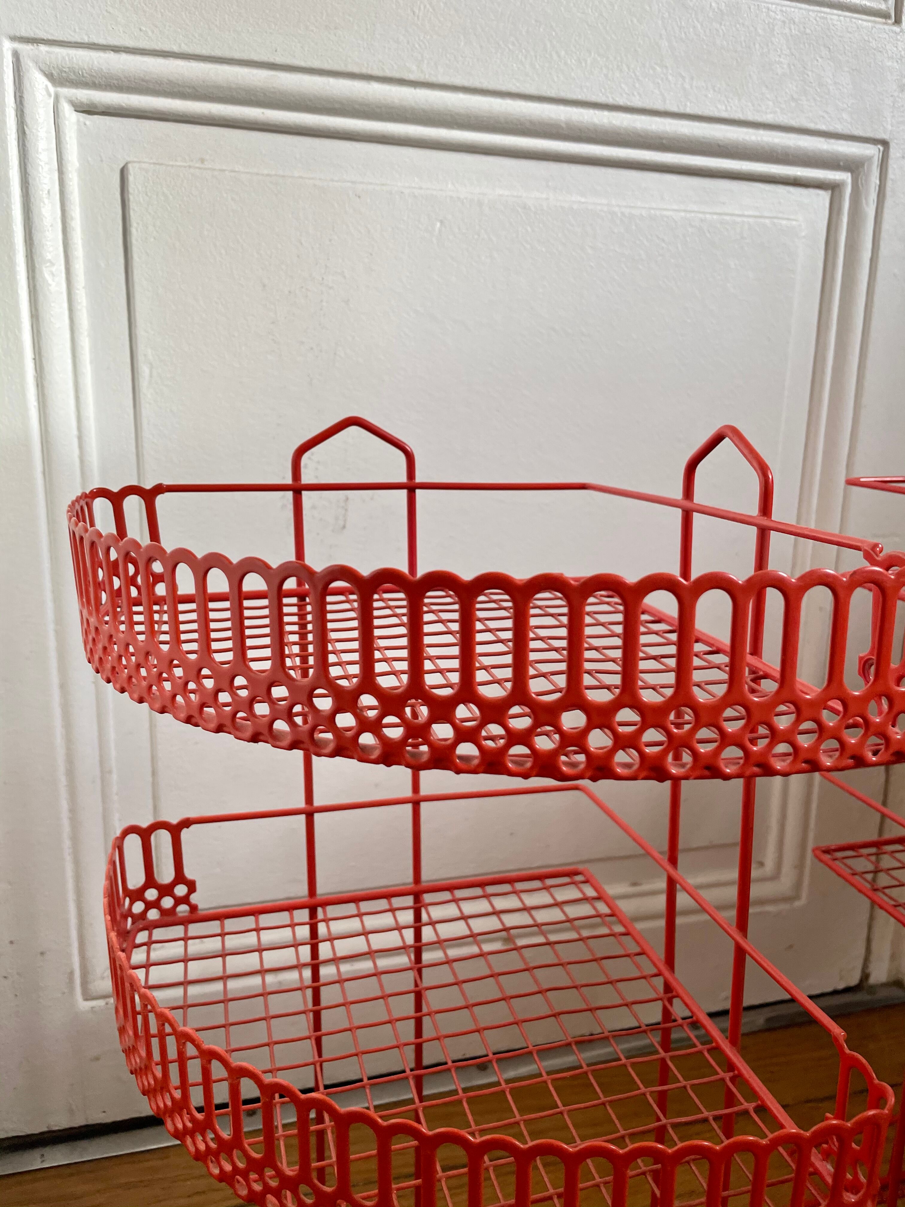 Red enamelled metal wall shelves