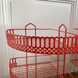 Red enamelled metal wall shelves