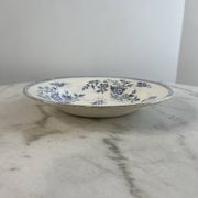 Hollow plate in ironstone from Terre de Feu of Grigny with floral decoration bl