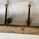 Coat rack with 5 double metal hooks and vintage wooden balls from the 1950s.