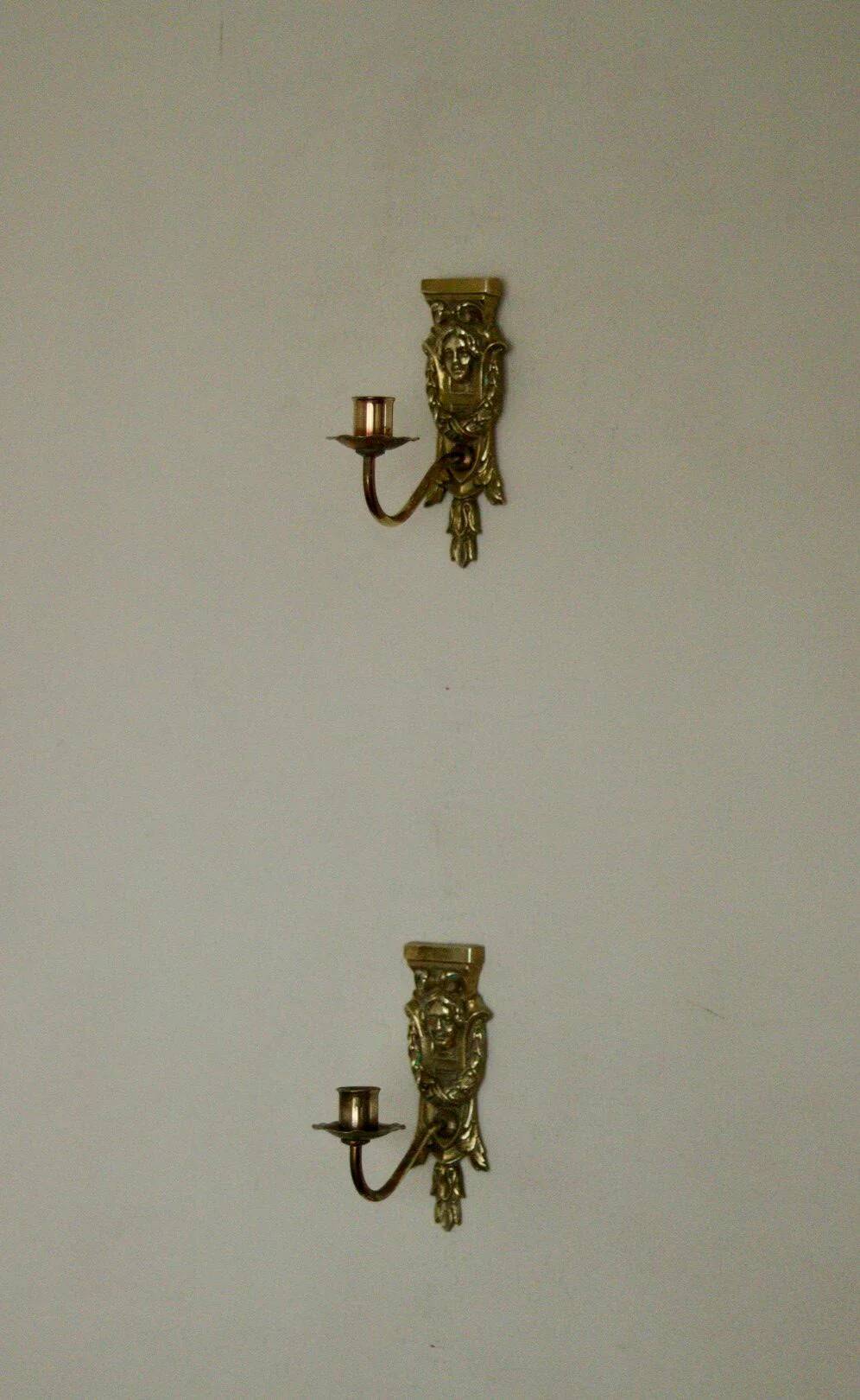 Pair of mid-century Swedish brass face motif sconces