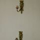 Pair of mid-century Swedish brass face motif sconces