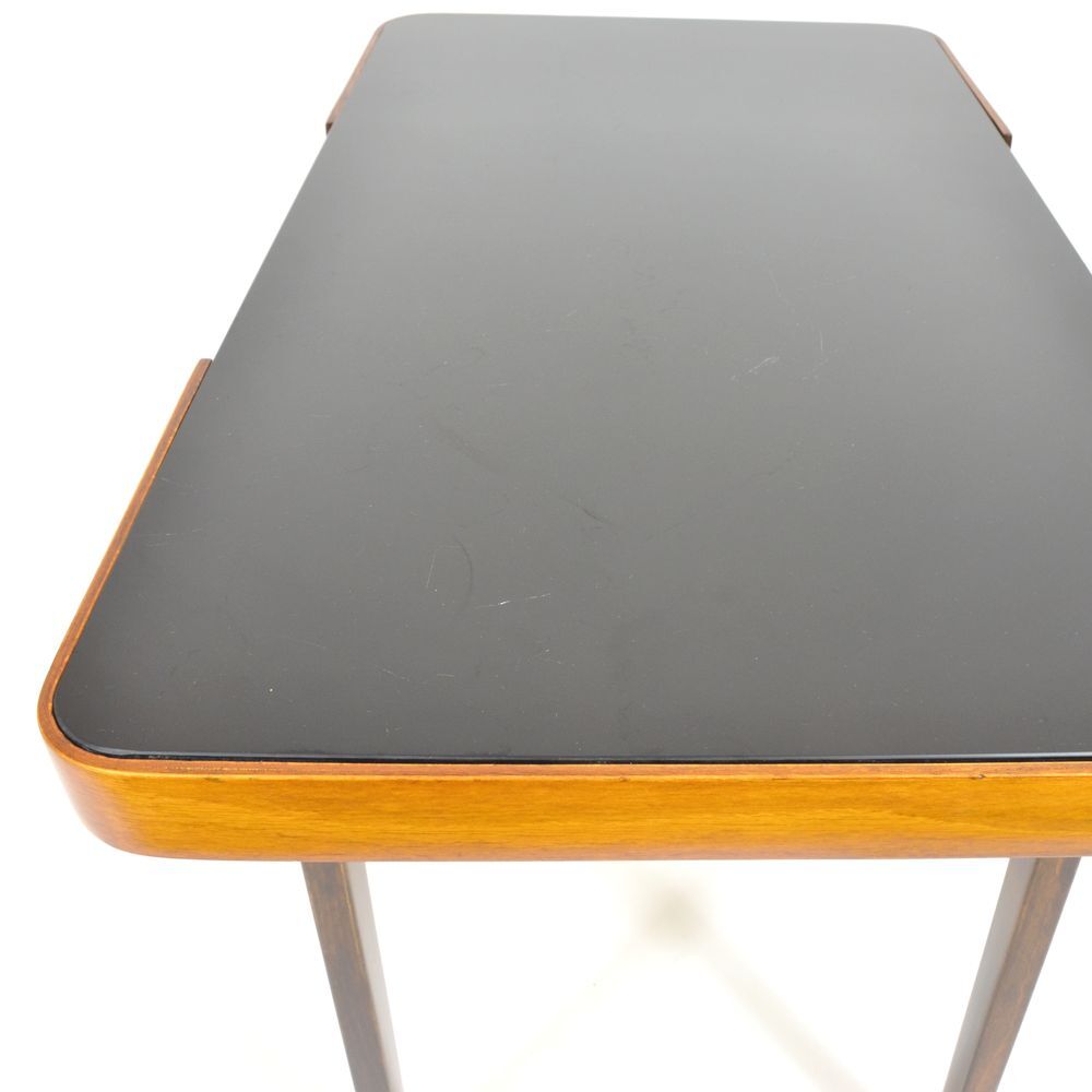 With 70 years black glass coffee table