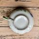 Large cup and saucer in the quimper earthenware style.
