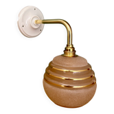 Vintage pink and gold frosted glass globe wall light.
