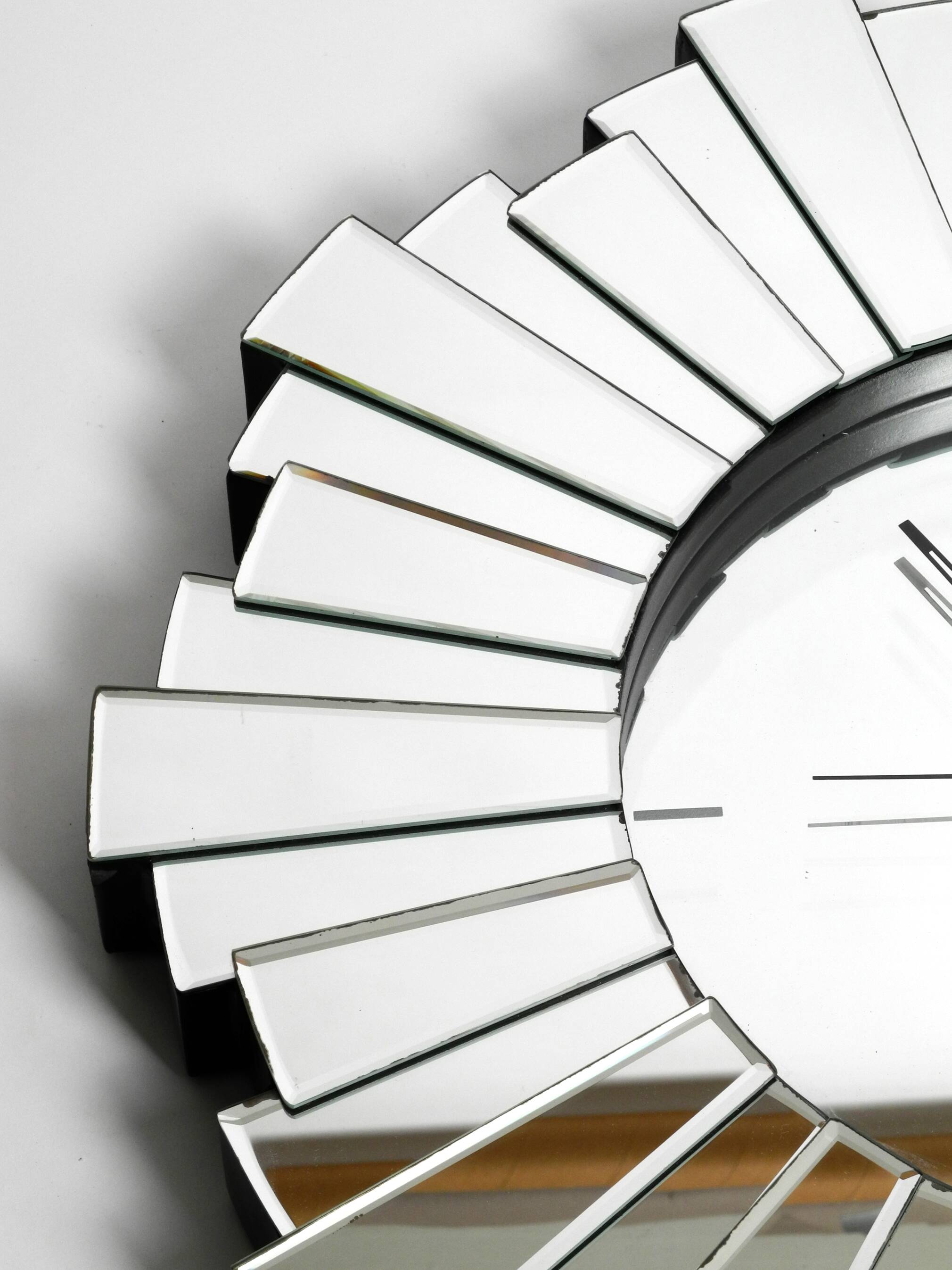 Gigantic rare heavy Sunburst mirror wall clock from the 1970s | Ø 70 cm