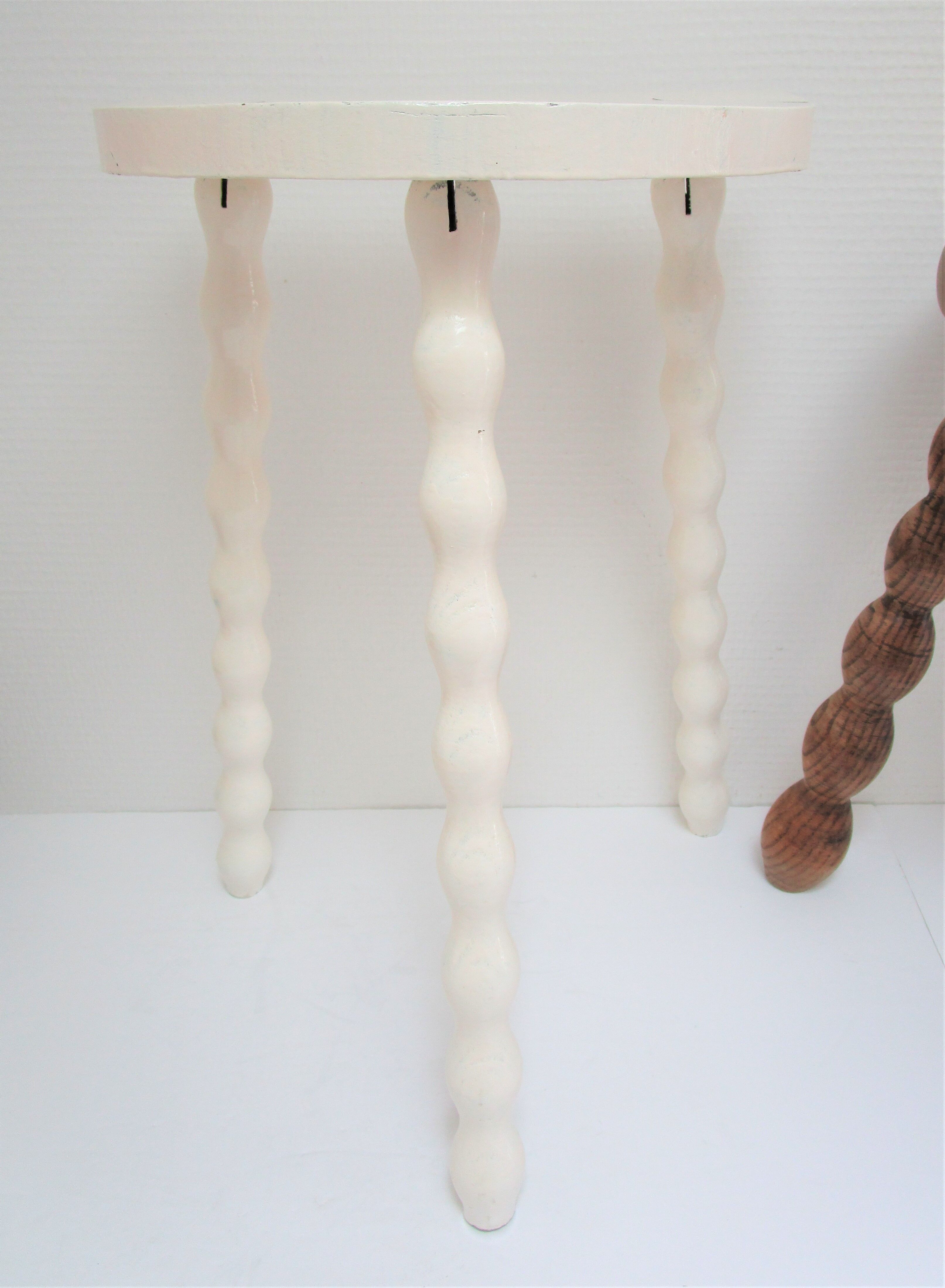 Two vintage tripod solid wood stools