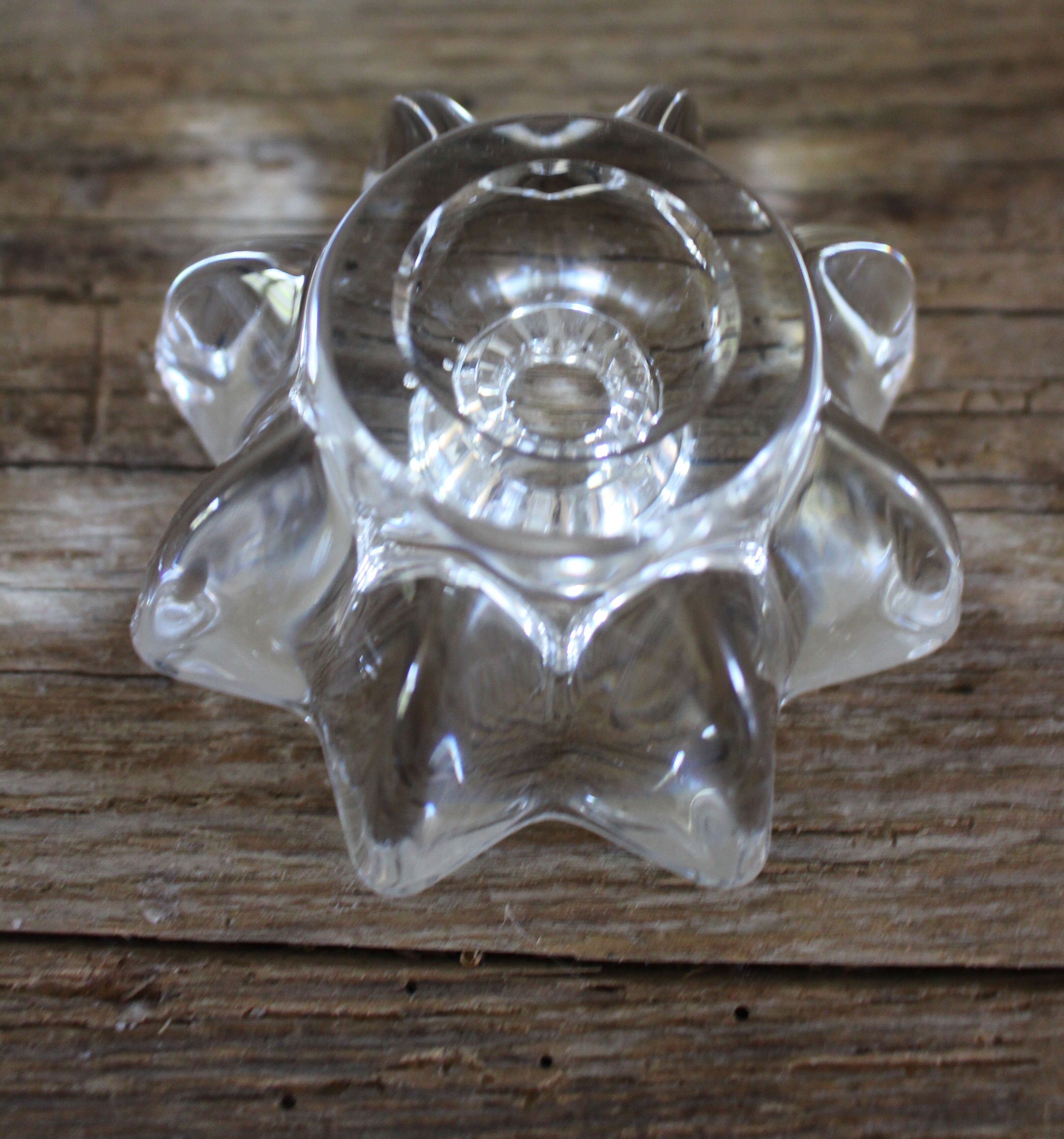A vintage star flower glass candlestick.