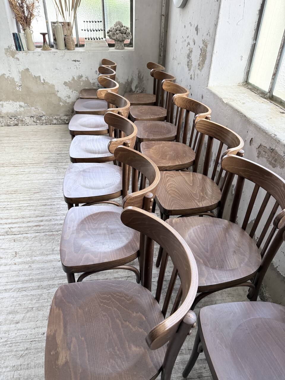 Set of 14 walnut bistro chairs.