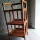 Shelf selette on wooden feet and vintage rattan