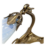 Art Nouveau wall sconces with opalescent iridescent glass