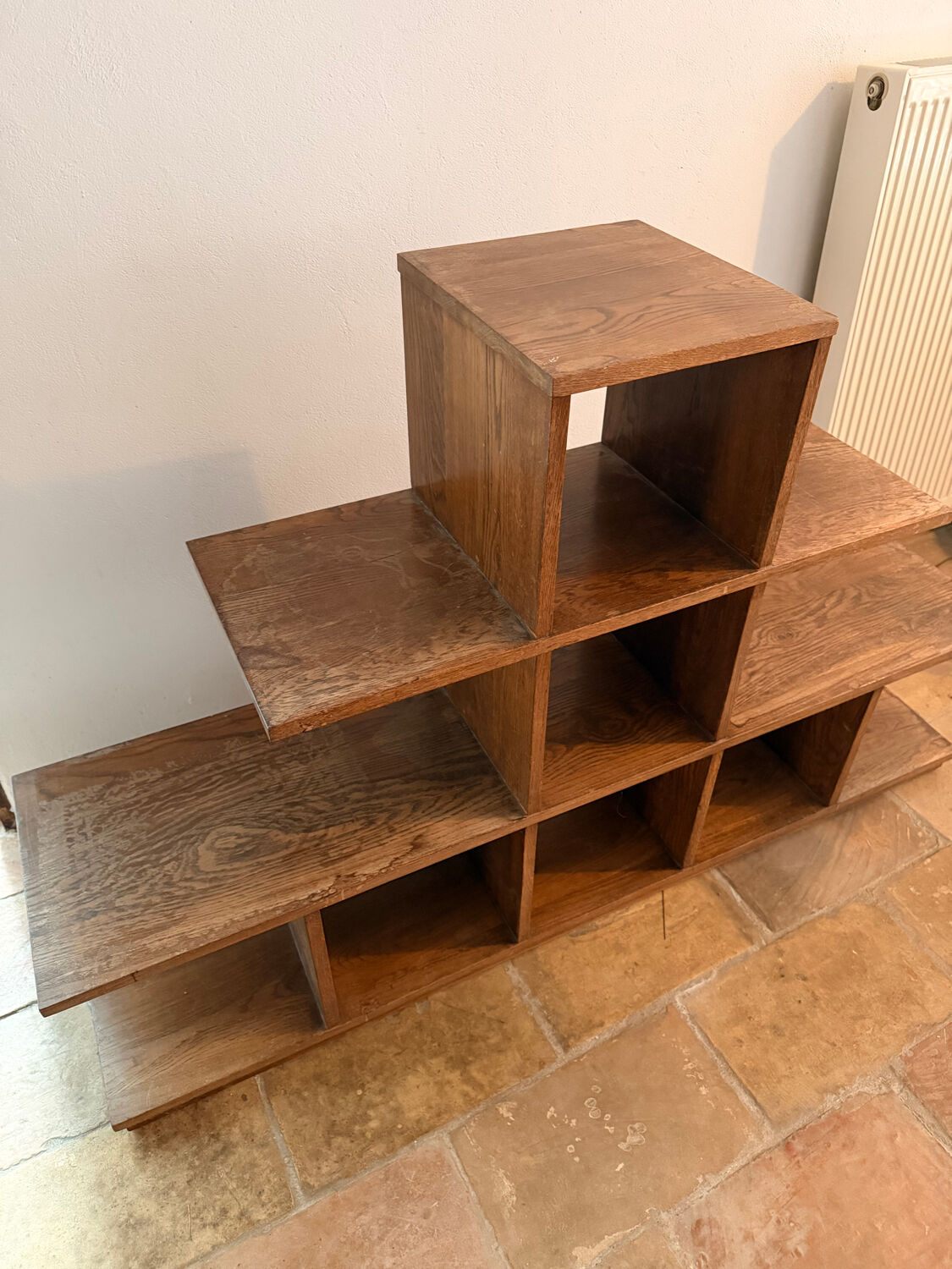 Low wooden shelf in 1960s brutalist style.