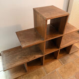 Low wooden shelf in 1960s brutalist style.