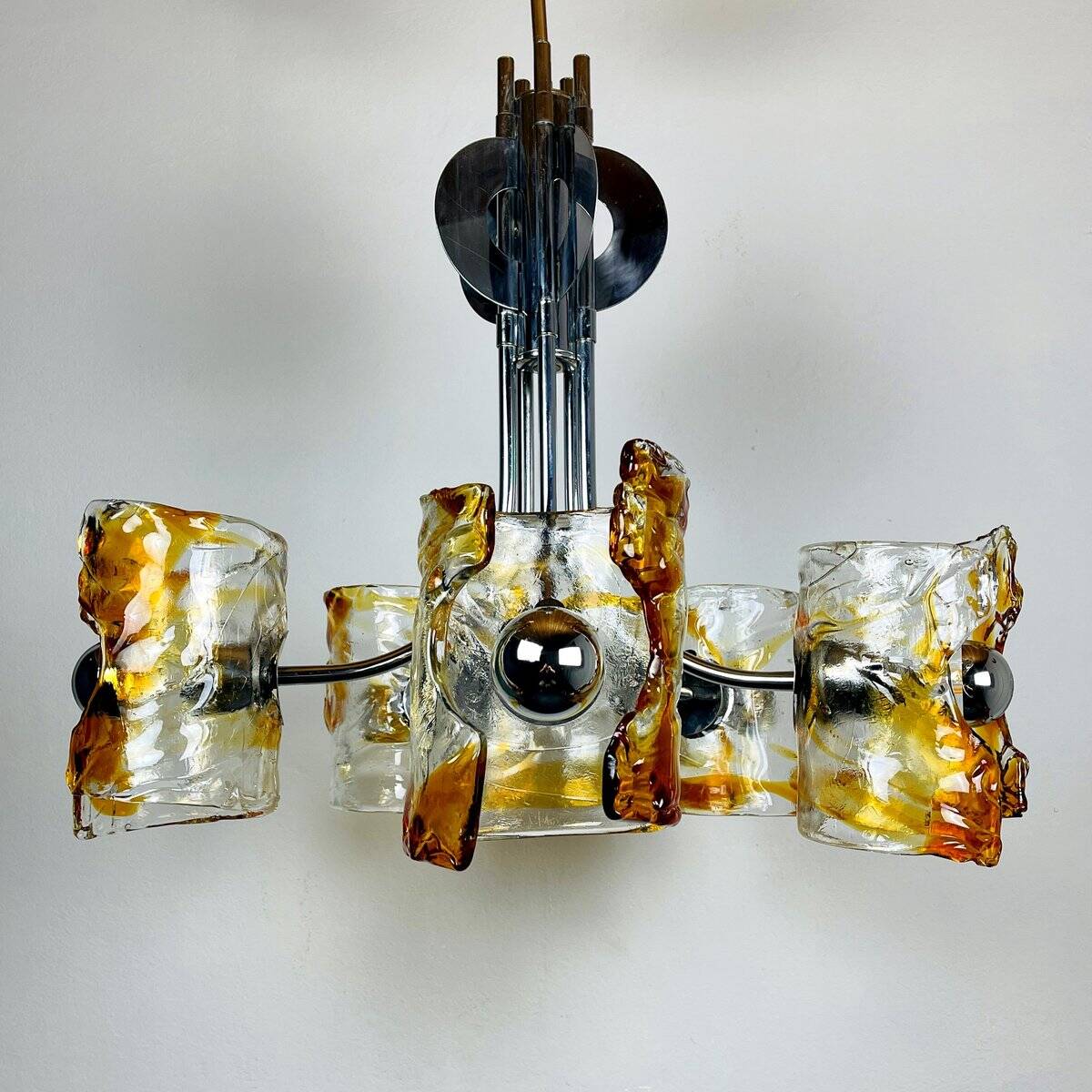 Mid-century chandelier in amber Murano and chrome by Toni Zuccheri for Mazzega, Italy, 1970s.