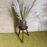 Standard seating tripod stool.