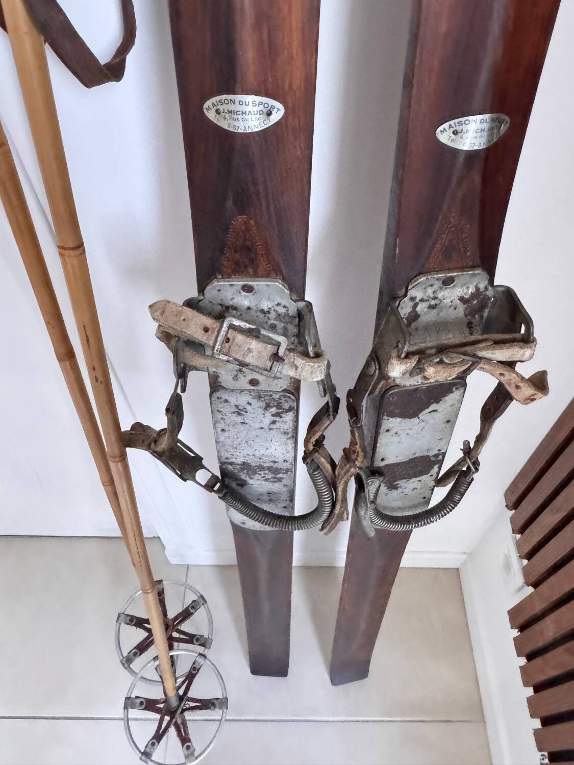 Antique wooden skis with vintage poles