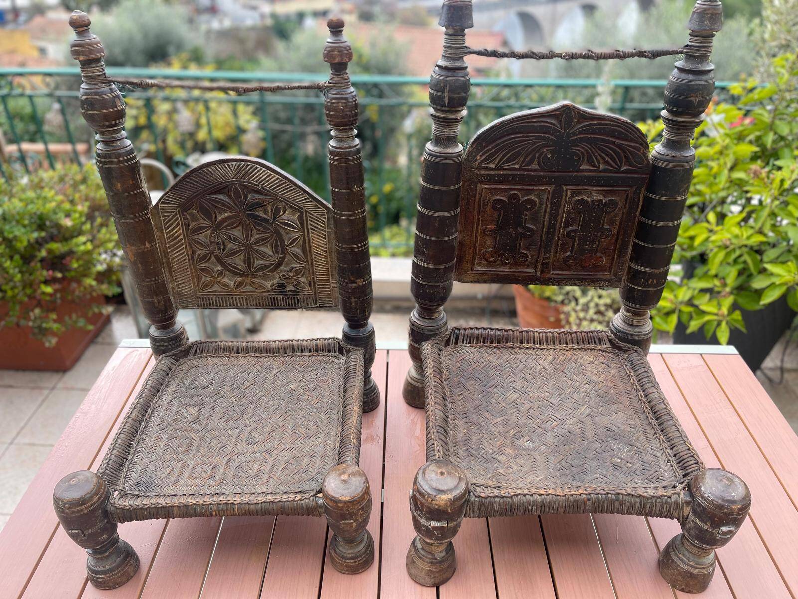 Pair of antique traditional Indian carved wooden chairs