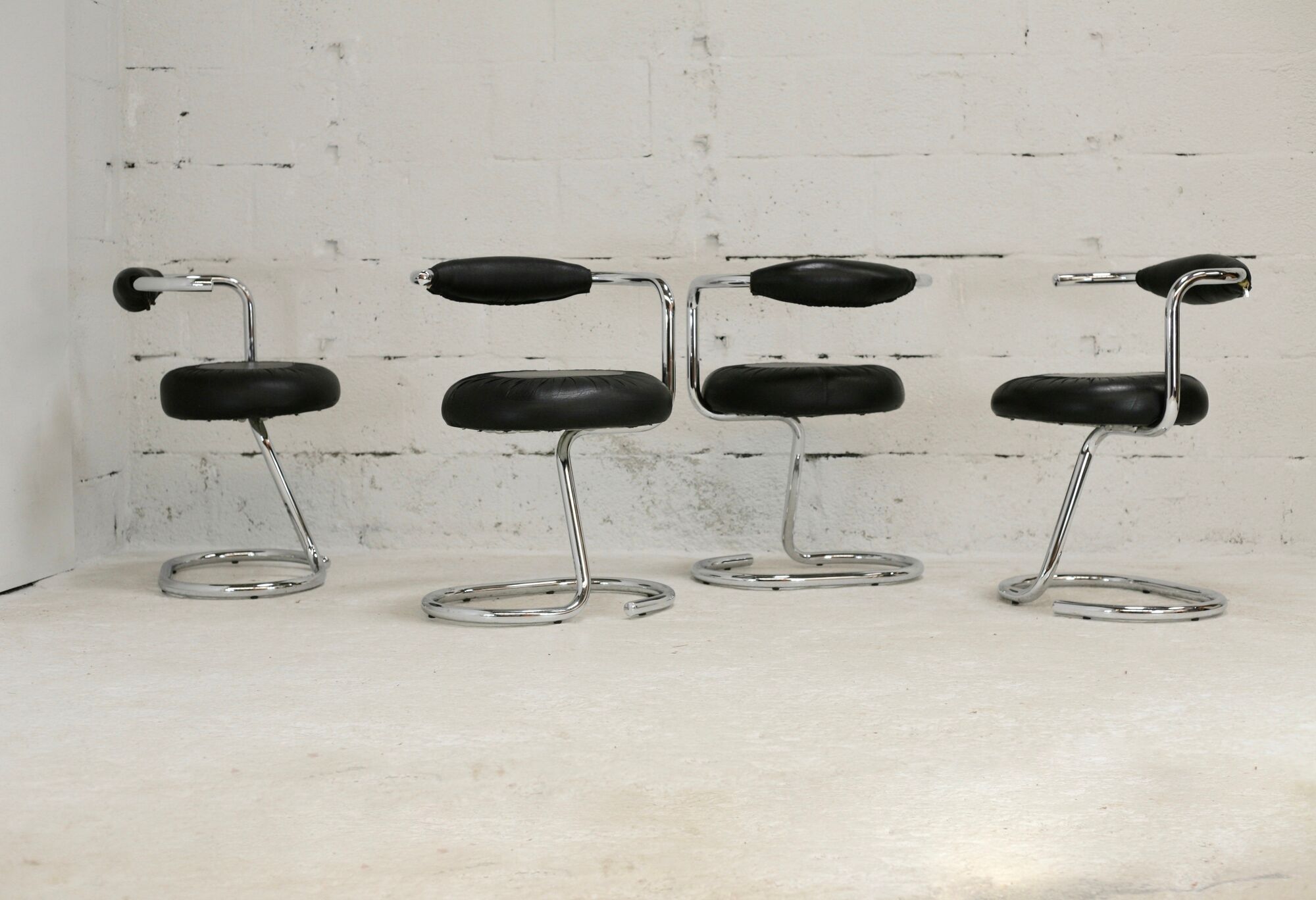 4 chairs tubular steel, imitation black leather, Italy, circa 1970