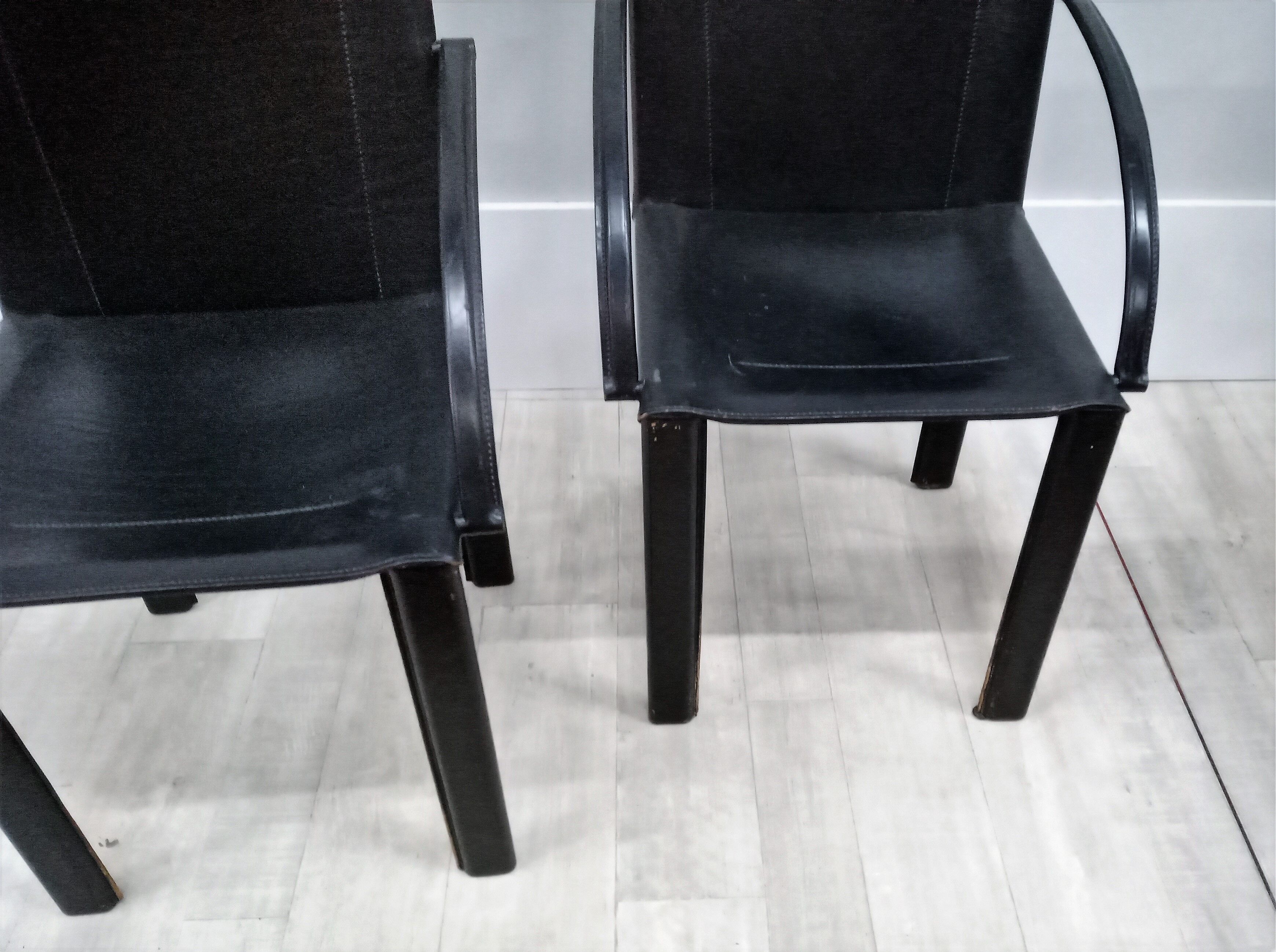 Black leather coral chairs by Matteo Grassi