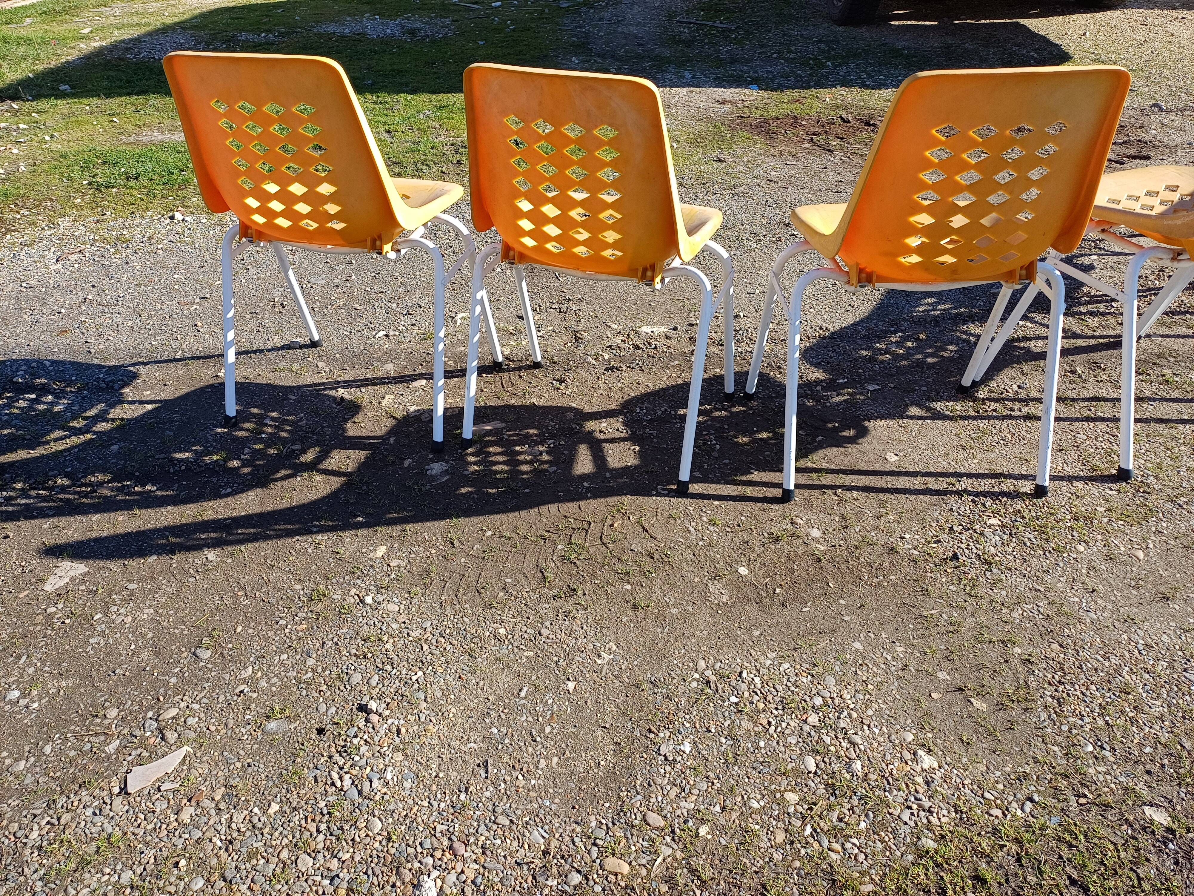 6 vintage iron and orange plastic garden chairs