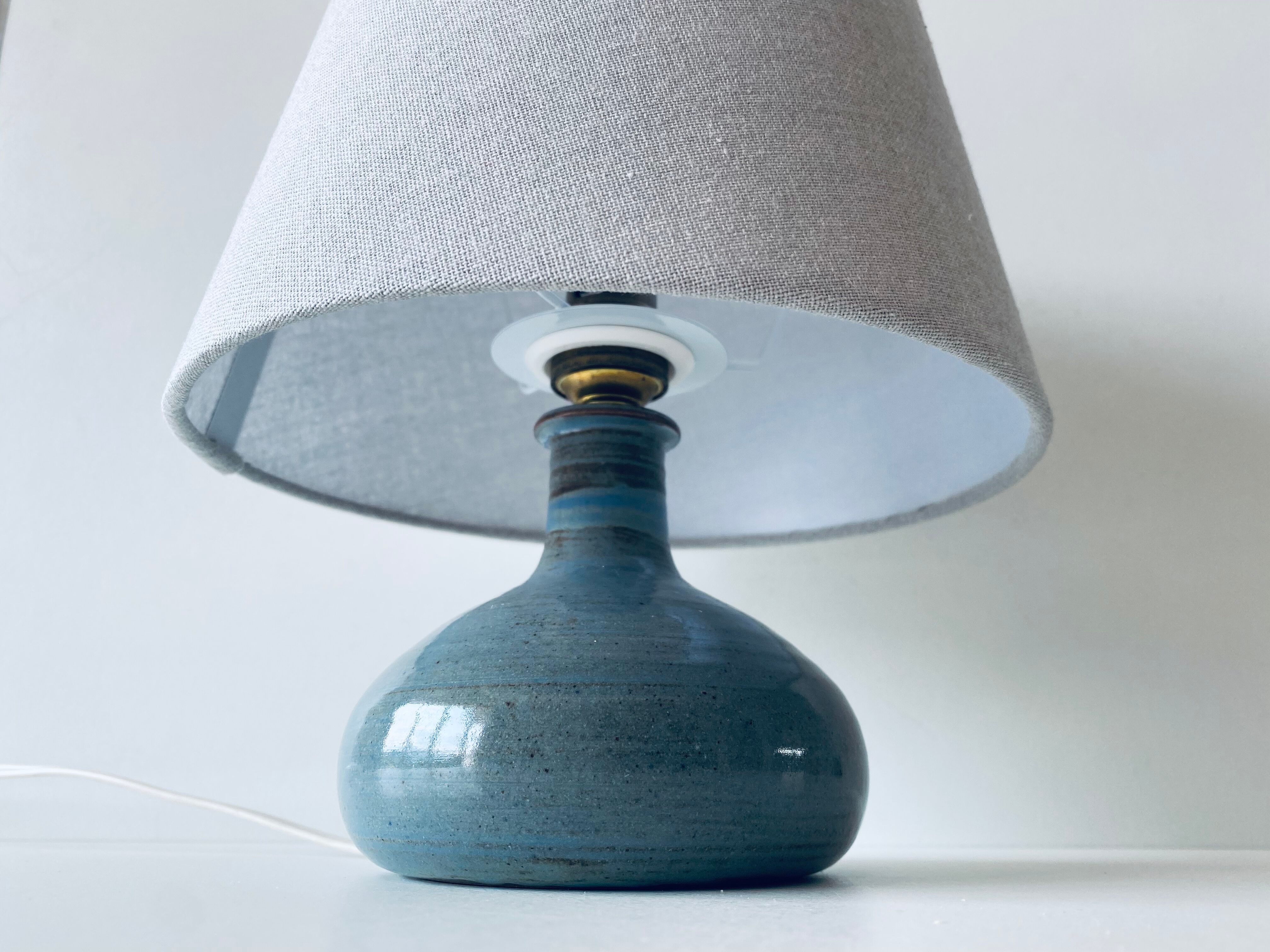 Lamp in enamelled sandstone