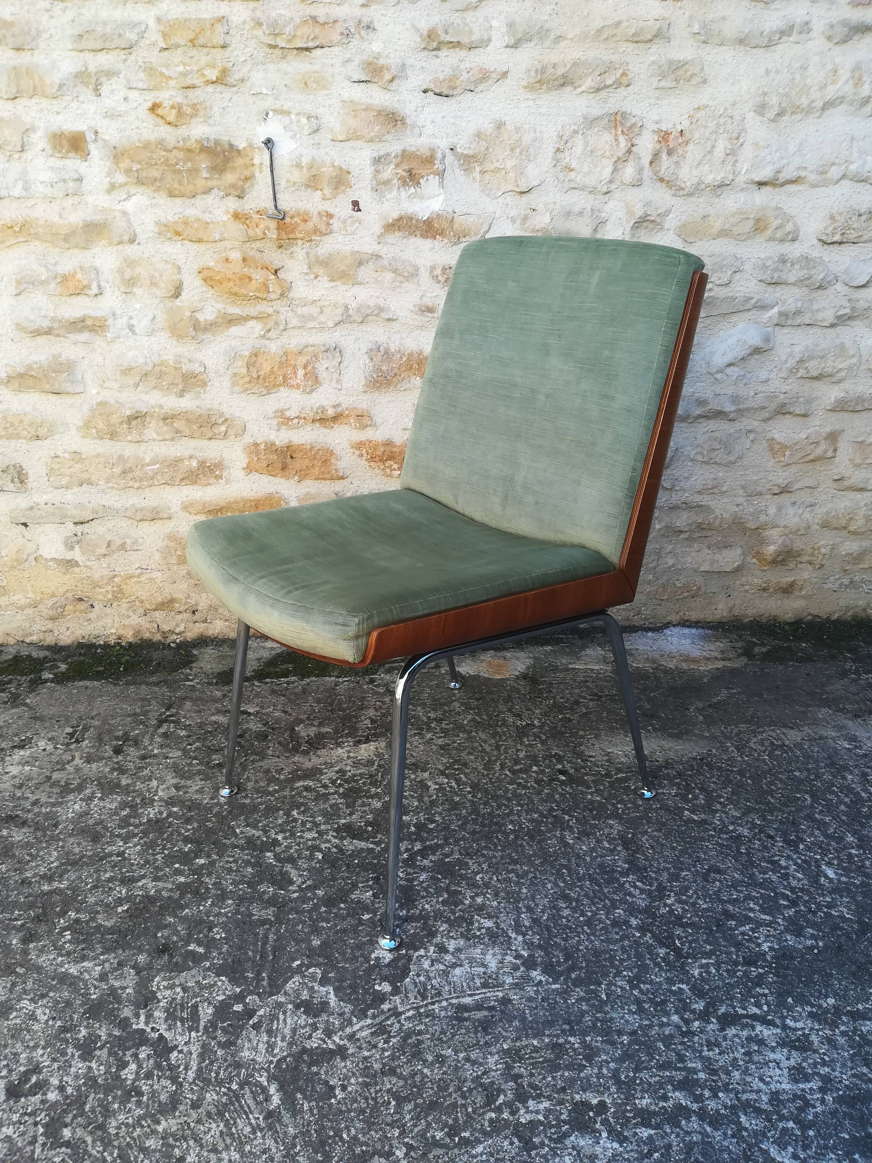 Shell chairs and green fabric