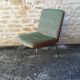 Shell chairs and green fabric