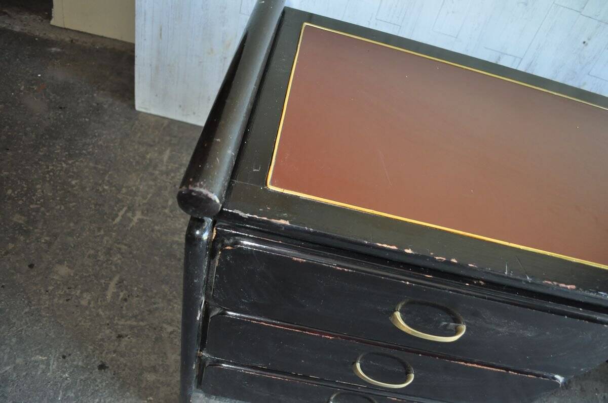 Hungarian Art Deco desk in black painted wood with a brown top and metal handles.
