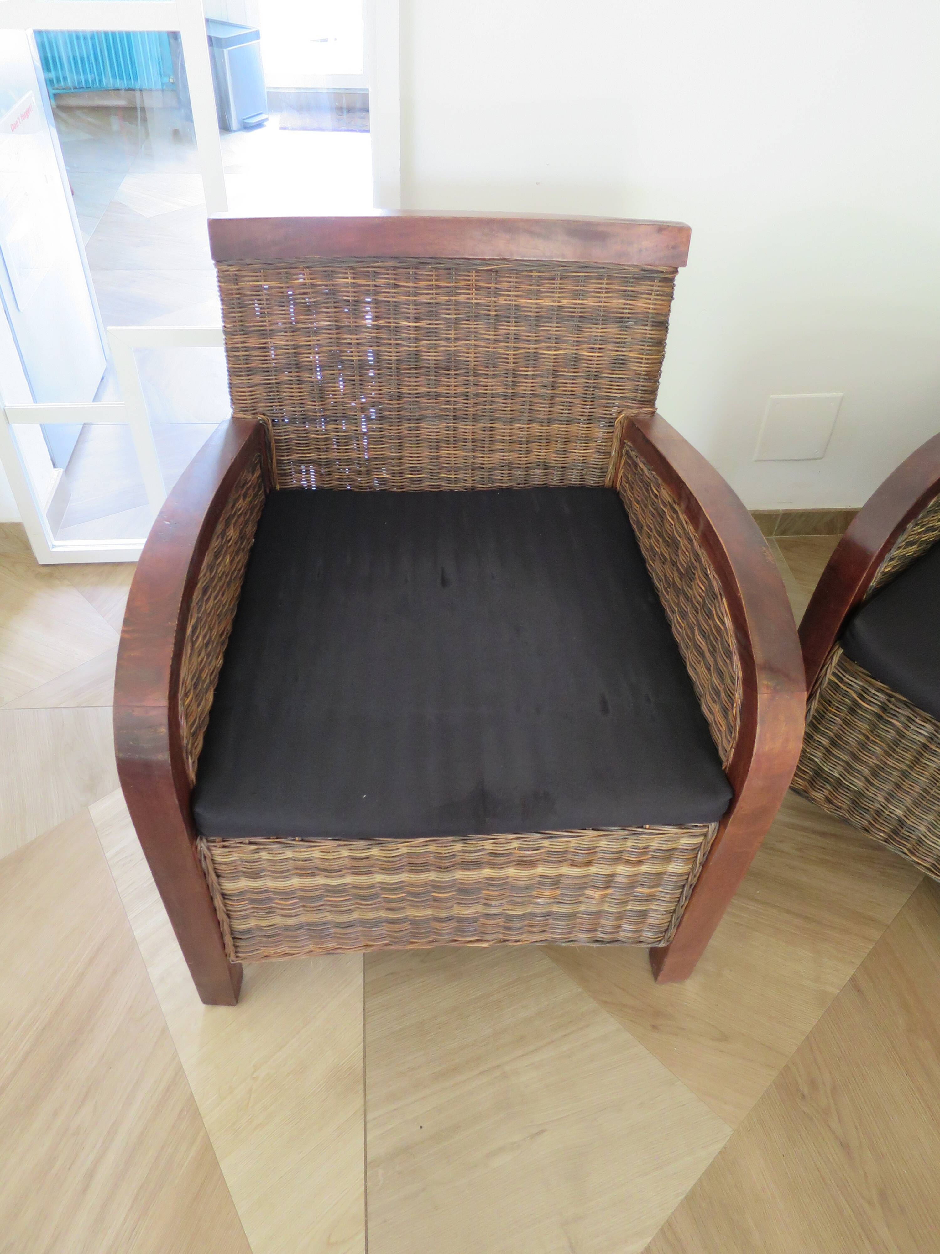 2 colonial-style armchairs in woven rattan and exotic wood