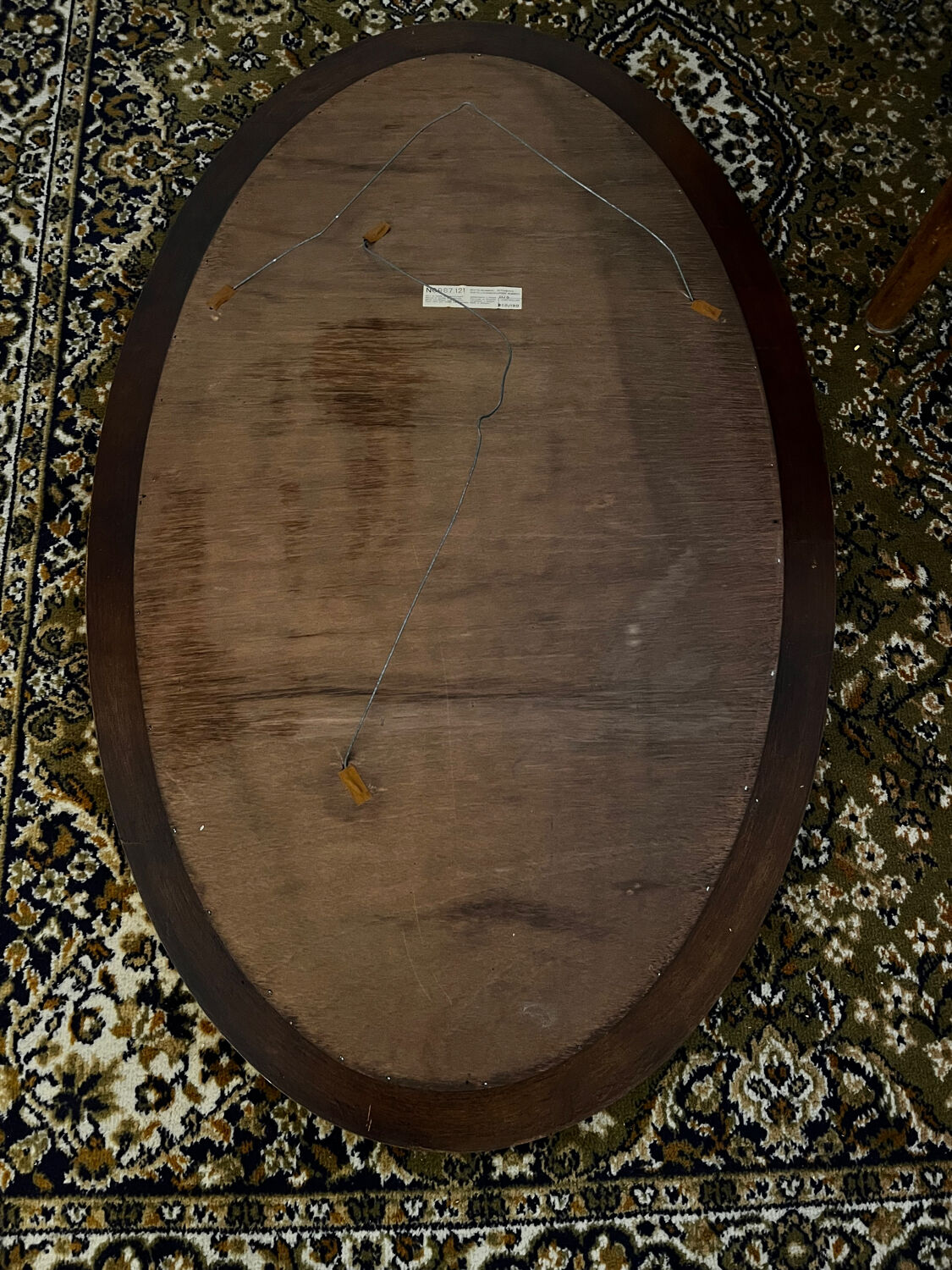 Antique oval mirror made in Belgium.