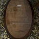 Antique oval mirror made in Belgium.