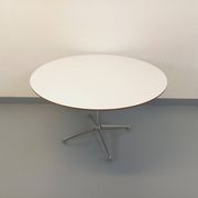 Vintage Eames round table for Vitra in white melamine, wood, and metal.