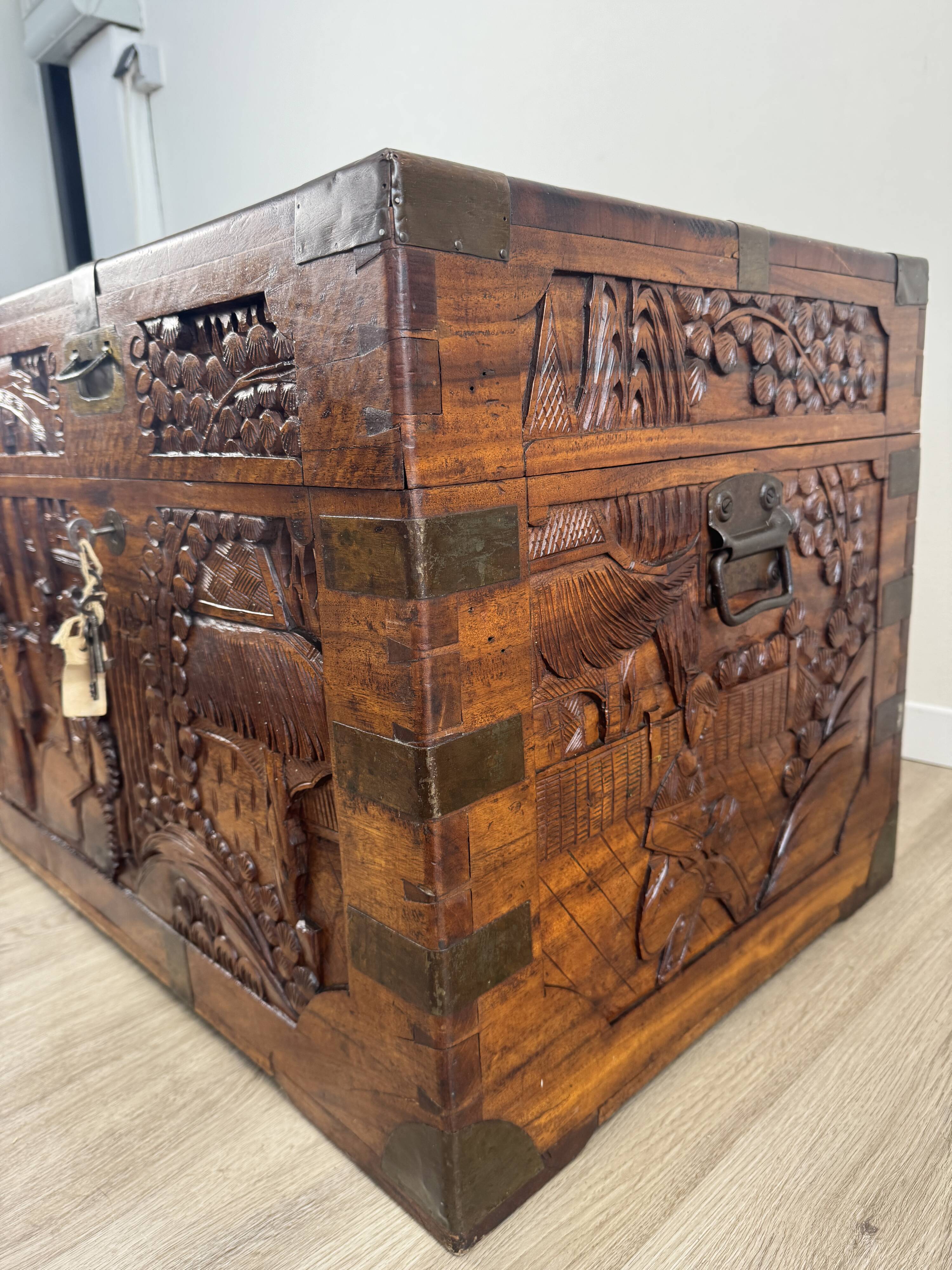 Chinese carved chest made of solid wood — life scenes in bas-relief