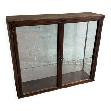 Dark-stained wood and glass vintage display cabinet — early 20th-century wall-mounted showcase