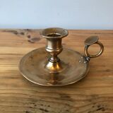 Old copper hand-held candlestick